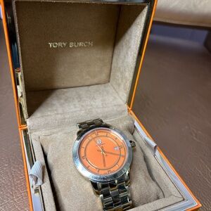 TORY BURCH ORANGE WATCH USED, BATTERY REPLACEMENT NEEDED.